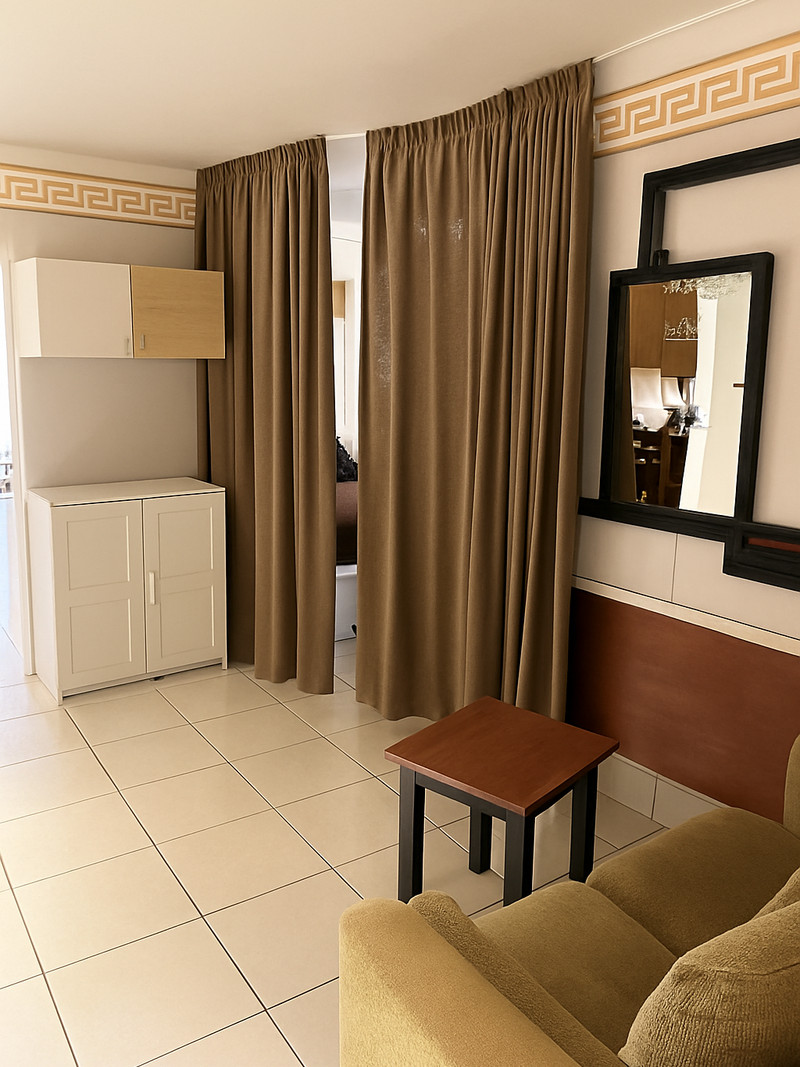 Living area with seating group and baby cot